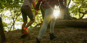couple walking in woods