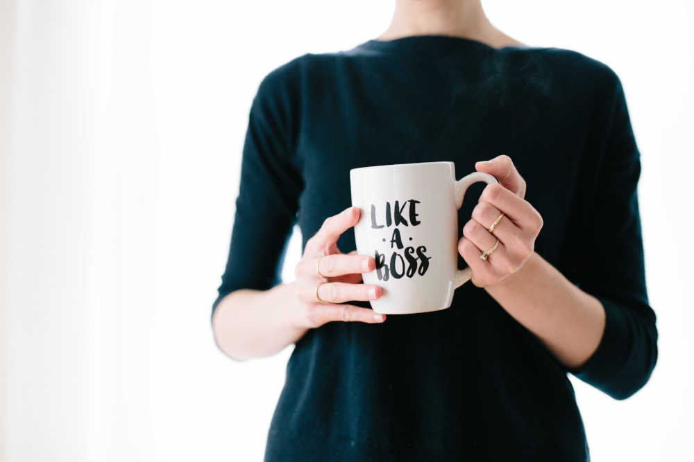 woman holding a cup